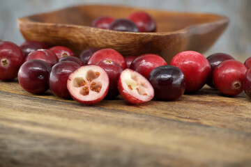 Kitchen scene with fresh cranberries on rustic table