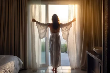 Fotobehang room hotel luxury curtains opening bathrobe white wearing woman Young morning female window adult person home interior open view travel curtain light girl beautiful lifestyle looking lady © sandra