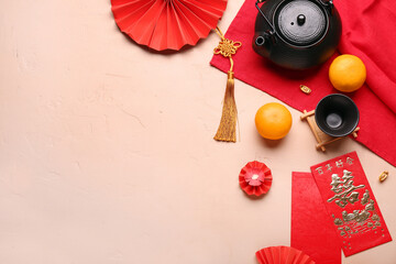 Teapot with envelopes, mandarins and oriental symbols on beige background. New Year celebration
