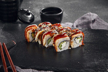 A delectable Canada maki roll with succulent eel and rich unagi sauce, sprinkled with sesame seeds,...