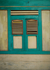 Old wooden windows, traditional Javanese wooden windows, windows commonly used in houses in Central Java, Indonesia, in the past.