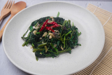 Cah kangkung or stir fried water spinach