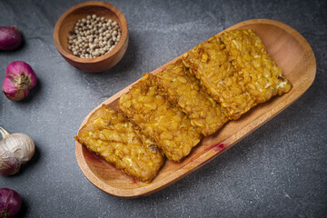 Slices of Fried Tempeh or Tempe. Indonesian Food made from farmented soybean.