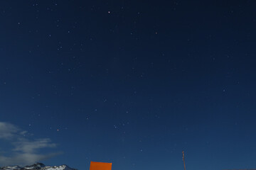 Antarctic base and stars in the night sky