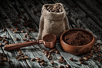 Coffee Beans In Burlap Bag And Coffee-ground In Measuring Spoon.