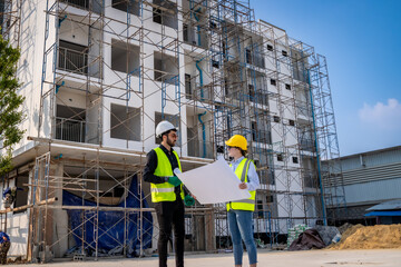 Engineer inspect building structure technicians looking at analyzing unfinished construction project