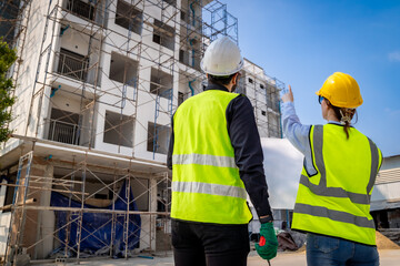 Engineer inspect building structure technicians looking at analyzing unfinished construction project