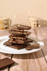 Pieces of chocolate stacked on a white plate