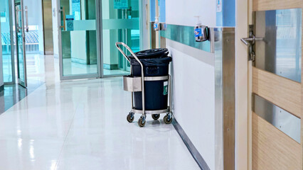 Garbage Bin Trolley with cover in building. Trolley and garbage bin for waste. trolley with waste...