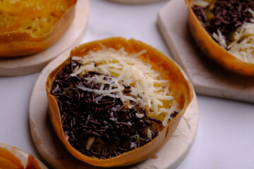 Martabak Manis. Sweet martabak. Sweet snack made from flour, eggs, vanilla, topped with grated...