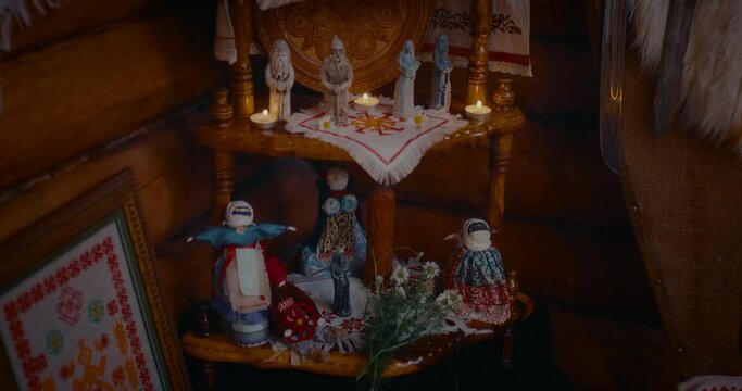 culture and tradition of Slavic paganism, altar with idols, amulets and candles in house, 4K, Prores