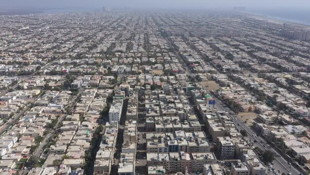 Aerial footage of the cityscape of Karachi the capital of Sindh Province on a sunny day, Pakistan