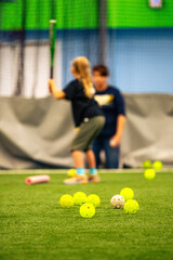 A girl playing  softball 