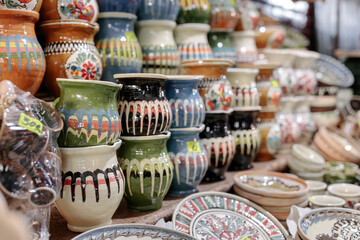 A Colorful Array: A Vibrant Display of Various Colored Vases on a Table