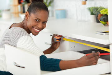 young black woman renovating her kitchen