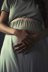 Naklejka premium Image of a family's hands on a pregnant belly, representing the support and love surrounding the expecting mother