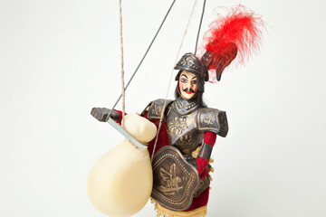 Sicilian puppet, opera dei pupi with typical 'Provola' cheese isolated on white background