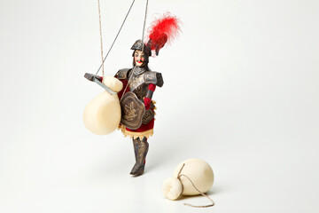 Sicilian puppet, opera dei pupi with typical 'Provola' cheese isolated on white background