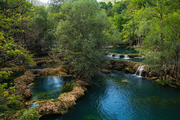 Travertine pools in the River Una at the Small Waterfalls at Martin Brod in Una-Sana Canton,...