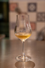Tasting of cognac spirit aged in old French oak barrels in cellar in distillery in Cognac white wine region, Charente, Segonzac, Grand Champagne, France