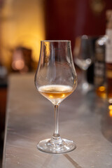 Tasting of cognac spirit aged in old French oak barrels in cellar in distillery in Cognac white wine region, Charente, Segonzac, Grand Champagne, France