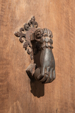 Ancient traditional hand  as moorish door knocker  in Granada, Andalucia, Spain