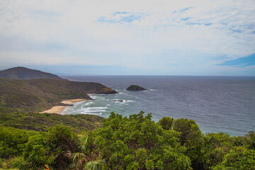 View the beach frome Smoky Cape Lighthouse/Beutiful small bay with beach and waves/Beach view from smoky cape/Smoky cape Lighthouse,South west rock, at Australia/