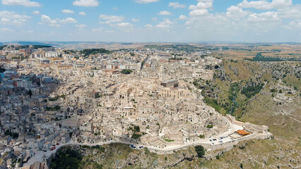 Fototapeta na wymiar Matera, Italy. The old part of the city is carved into the rock and is a UNESCO World Heritage Site. Summer day, Aerial View