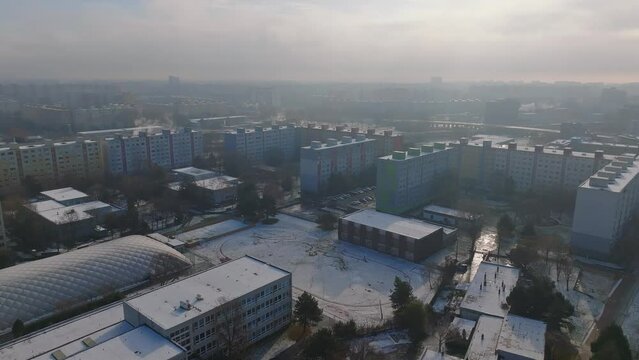 Cold winter city with Constructivist panel Houses Architecture. Snowy city - Aerial view.