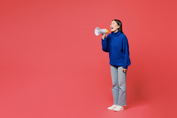 Full body young woman of Asian ethnicity she wear blue sweater casual clothes hold in hand...