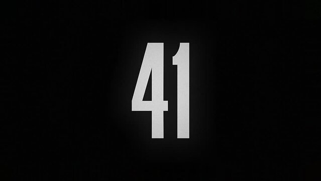 The number 41 smolders and burns on a black background, the number is on fire