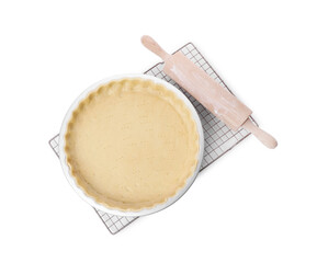 Quiche pan with fresh dough and rolling pin isolated on white, top view