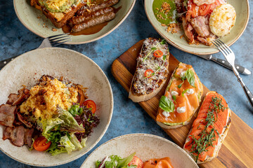table served with plates of Italian dishes