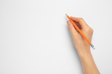 Woman with new graphite pencil on white background, top view. Space for text - Powered by Adobe