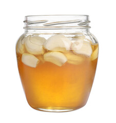 Honey with garlic in glass jar isolated on white