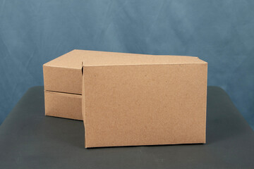 Two cardboard boxes on a gray background. Close-up. Copy space.