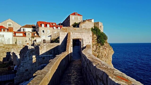 Walk on the ancient, defensive city wall in Dubrovnik, Croatia at the Dalmatian Coast of the Adriatic Sea.