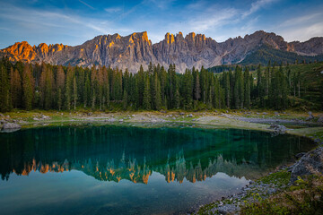 Lago di Carezza's emerald waters, misty forests, and Latemar views create an unparalleled Alpine charm