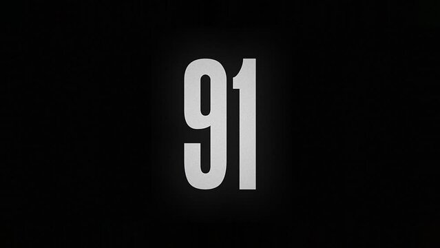 The number 91 smolders and burns on a black background, the number is on fire