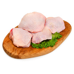 Fresh chicken thigh on a wooden board, on a white background, isolated
