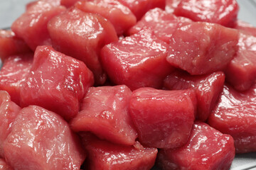 Cooking delicious goulash. Raw beef meat on table, closeup