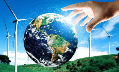 Concept of sustainability development by alternative energy. Man hand take care of planet earth...
