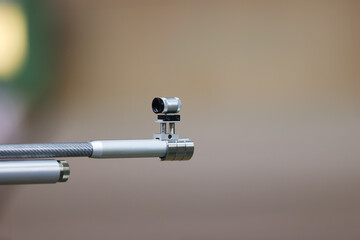 Close-up of an air rifle sight. Shooting gallery.