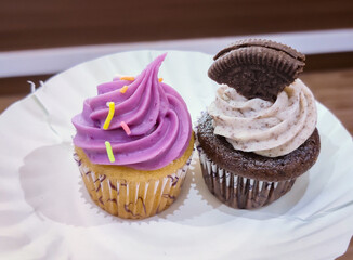 chocolate cupcake with icing and sprinkles