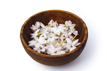 jasmine flower floating in wooden bowl, this delicate bloom is renowned for its sweet, floral aroma and its elegant appearance. isolated on white background, flower catalog concept, 45 degree shot