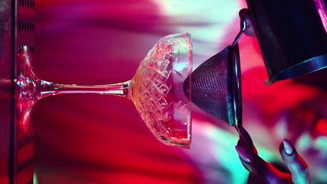 Premium Photo  Barman pours a cocktail into a shaker cocktail making and  mixology