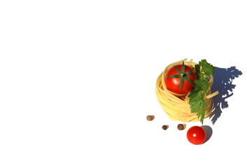 On a white background there is one curled spaghetti in the form of a nest with a tomato and pepper...