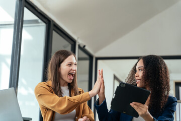 Happy creative business people are motivated, giving high five and celebration successful deal. Cooperation Meeting Partnership Career growth Team building Successful business.