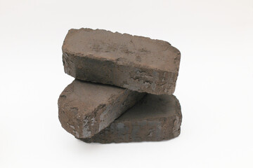 Peat briquettes on white background, alternative fuel. Peat briquettes close up