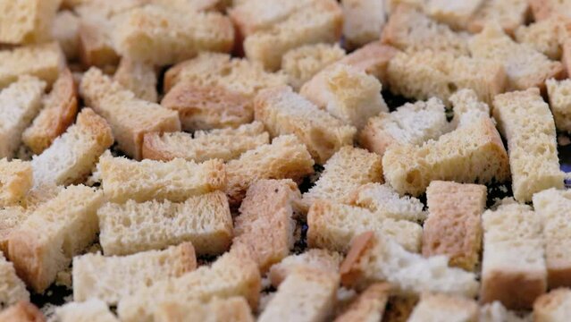 white bread croutons on flat surface, full-frame closeup view.